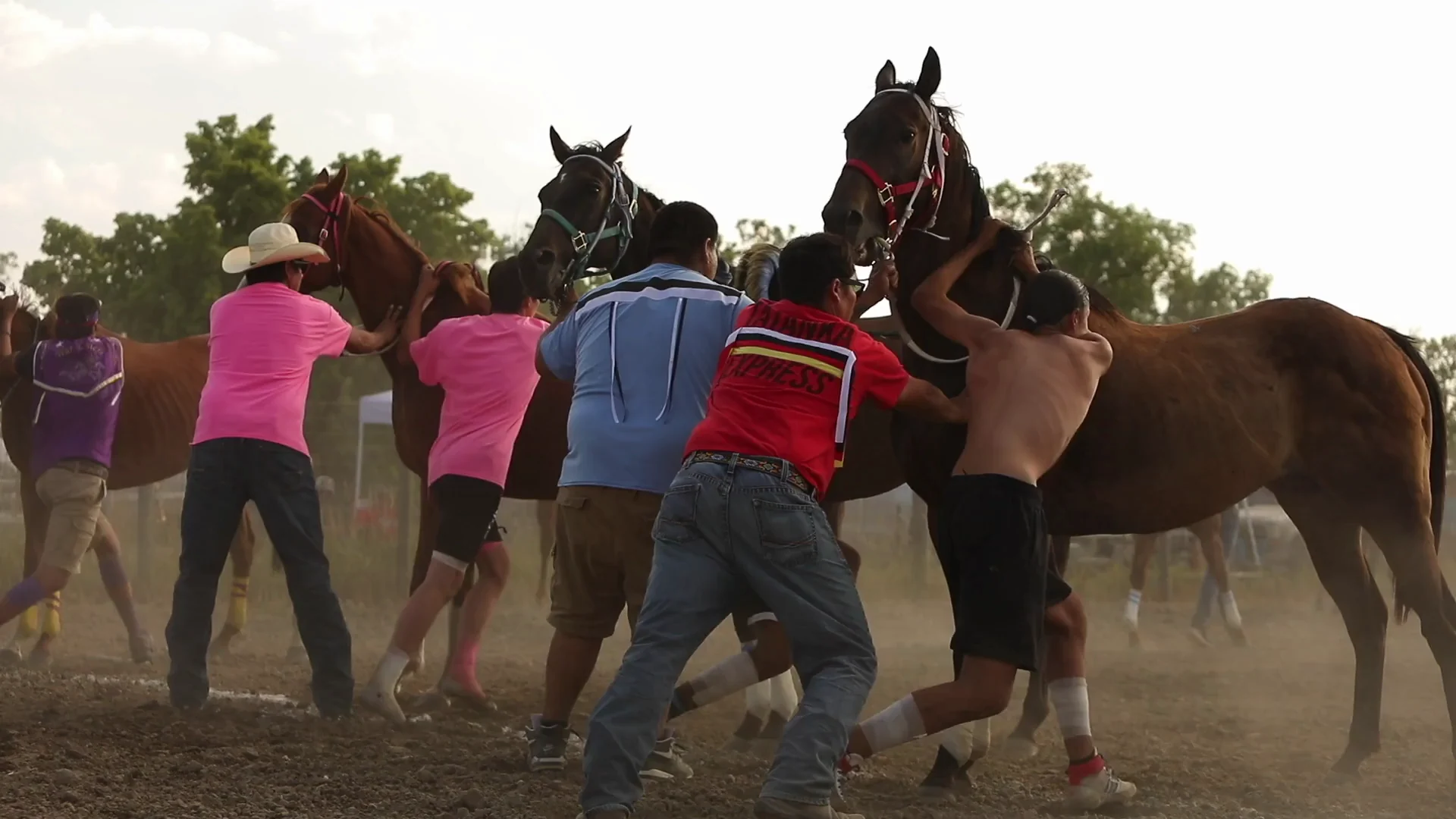 Indian Relay riders and horses at the racing grounds.